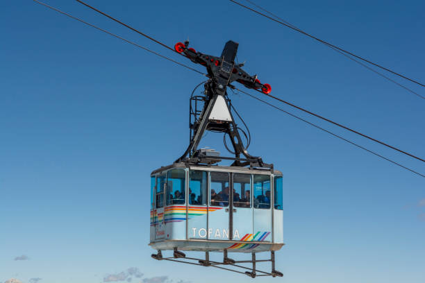Cable car or Gondola lift ascending from Cortina d'Ampezzo to Tofana di Mezzo in the summer. stock photo