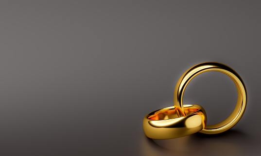 Illustration of two wedding gold rings with blank background. Unity concepts. 3d rendering