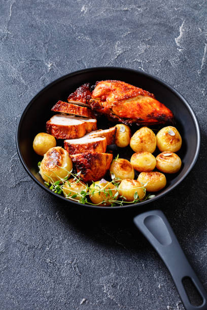istock grilled chicken breasts with browned new potatoes 1408573976