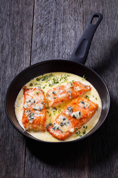istock salmon fillet with creamy blue mold cheese sauce 1408573987