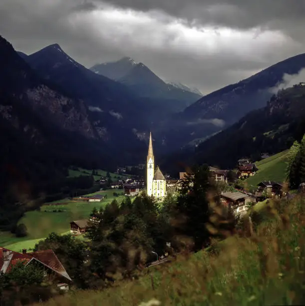 Alpine village Heiligenblut with church St.Vincent in Austria