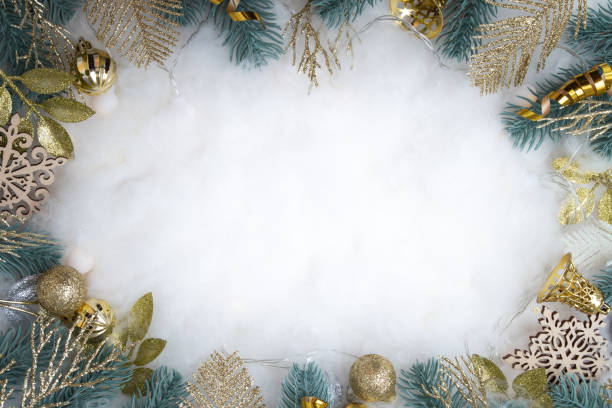 istock Happy Holidays text with frame made of Christmas decorations flat lay on snowy background 1408574973