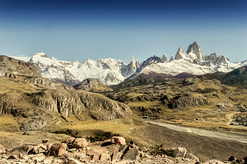 View from Town of El Chaltén, founded in 1985 in Los Glaciares National Park, near the Continental Ices in Patagonia. As a background, the Andes mountain, the Mt. Fitz Roy, Mt. Torre and Mt. Saint Exupery. Province of Santa Cruz, Argentina.