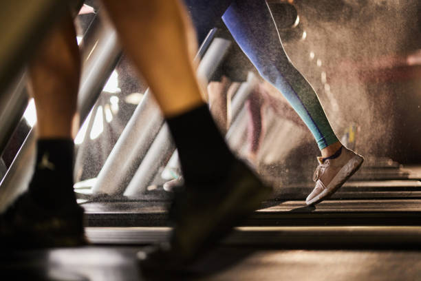 istock Unrecognizable athlete running on treadmill in a gym. 1408580248