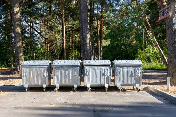 garbage containers on the site in the city park stock photo