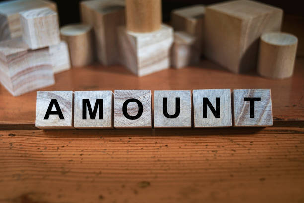 amount Word Written In Wooden Cube stock photo