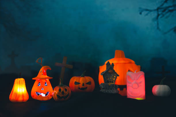 istock Spooky cemetery with glow halloween pumpkin 1408580511