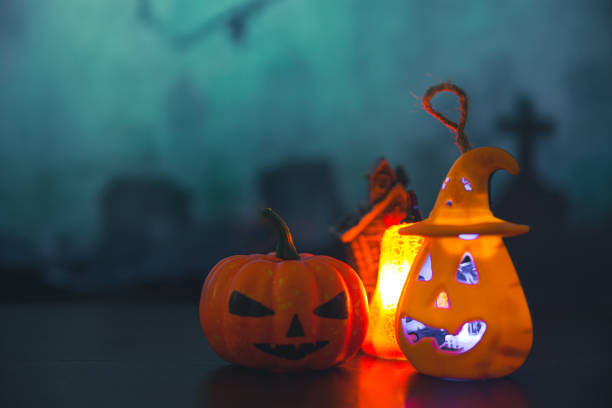 istock Spooky cemetery with glow halloween pumpkin 1408580648