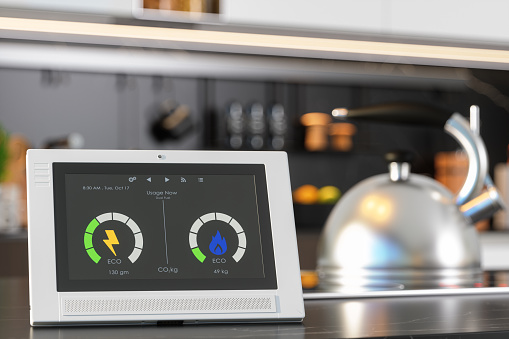 Close-up View Of Smart Meter On Empty Marble Surface With Blurred Kitchen Background