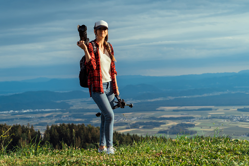 Woman photographer working outdoors