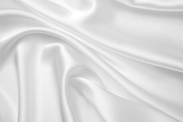 istock Smooth elegant white silk or satin luxury cloth texture can use as wedding background. Luxurious Christmas background or New Year background design 1408582881