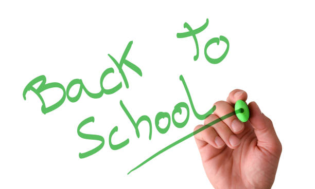 istock Hand writing in the air back to school with marker 1408589579