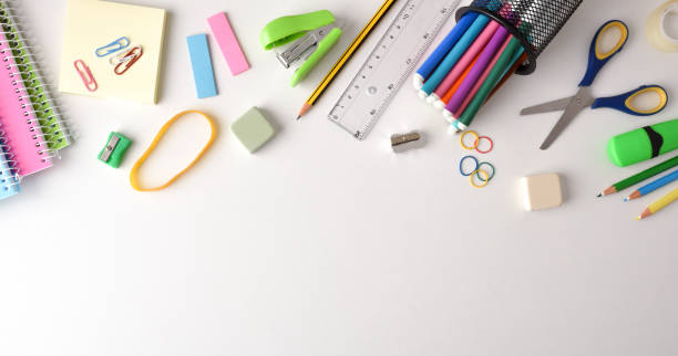 istock Background with school supplies on white table on top 1408589611
