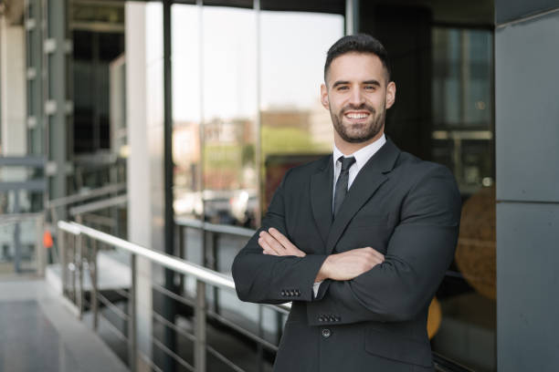 istock businessman in suit at street 1408590075