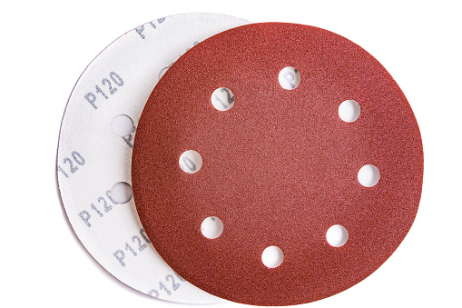 Circular sandpaper discs with 120 grit Velcro isolated on white background
