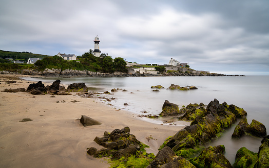 Stroove, Ireland - 9 July, 2022: view of the historic Stroove Lighthouse and beach on the Inishowen Peninsula on Ireland's Wild Atlantic Way scenic drive