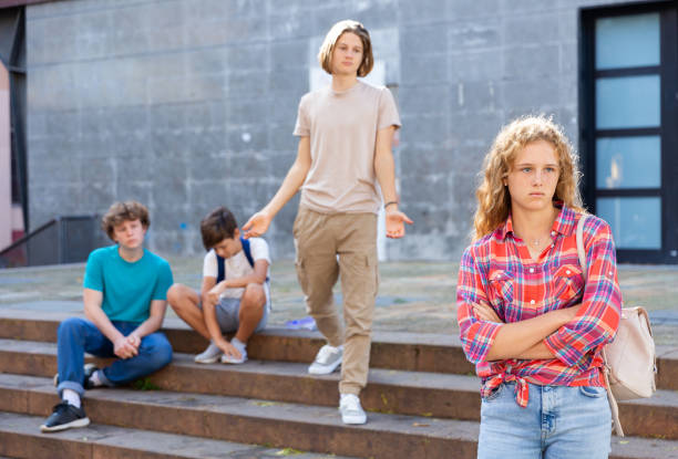 istock Sad girl quarreled with boys 1408594741
