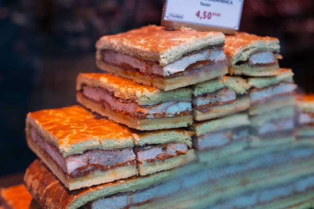 Traditional Easter meat pie in the Salamanca region called Hornazo with pork loin and Chorizo sausage, laid out on the counter \nfor sale in the store