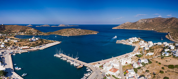 Aerial drone panoramic view of the Lipsi marina harbor with anchored sailboats located in the Dodecanese Cyclades islands of Greece in Europe