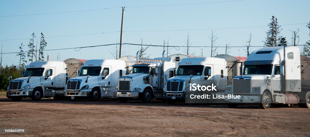 White Trucks in a parking lot. Trucks, Prince Edward Island, Nova Scotia, Canada. Truck Stock Photo