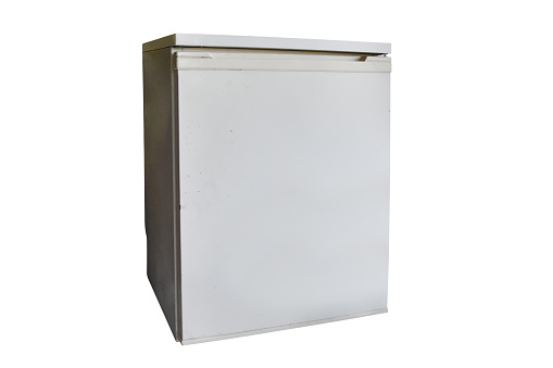Old and small refrigerator isolated on the white background with clipping path