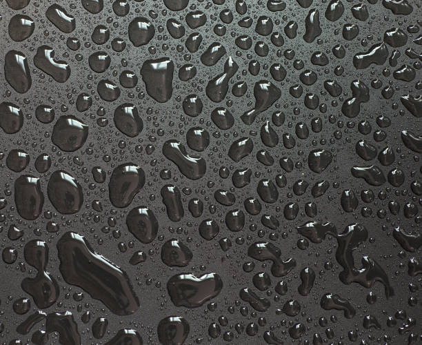 istock Big water droplets abstract shape on a black background. 1408610713