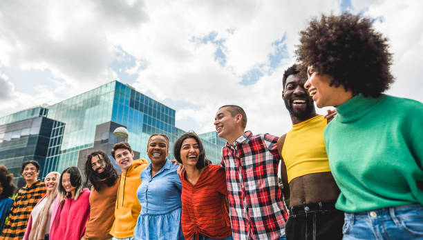 Young diverse people having fun walking together outdoor stock photo
