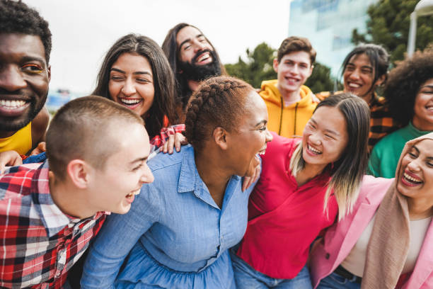 Young diverse people having fun outdoor laughing together Young diverse people having fun outdoor laughing together chubby arab stock pictures, royalty-free photos & images