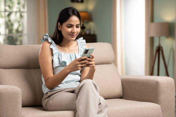istock pretty young woman using mobile. stock photo 1408614148