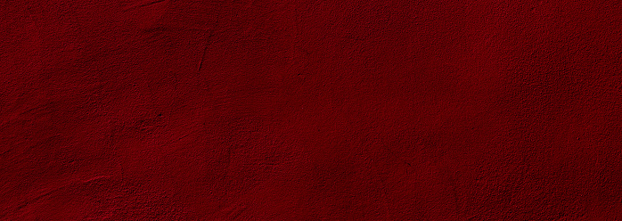 Crimson red colored wide panorama wall background with textures of different shades of crimson red