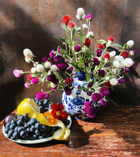 istock Bouquet with gomphrena, nasturtium, grapes and lemon 1408618024