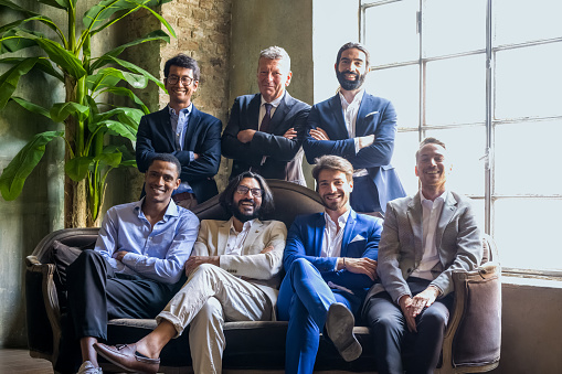 portrait of diverse businessmen, group of young and adult males working in the world of entrepreneurship, different generations and cultures collaborate in international projects