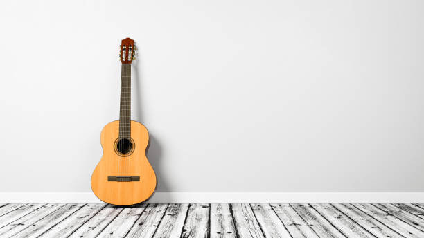 istock Classical Guitar on Wooden Floor Against a Light Gray Wall 1408618617