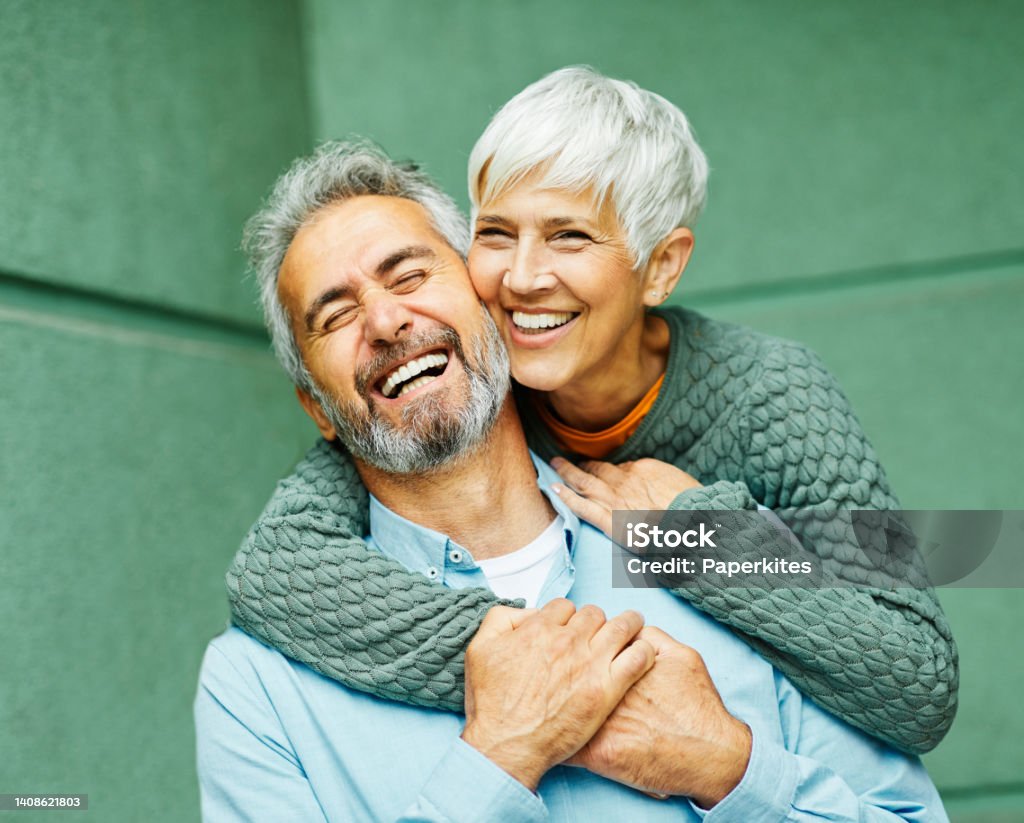 woman man outdoor senior couple happy lifestyle retirement together smiling love fun elderly active vitality nature mature Happy active senior couple having fun outdoors Smiling Stock Photo