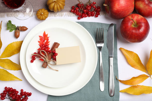 istock Beautiful autumn place setting with blank card and decor on table, flat lay 1408622380