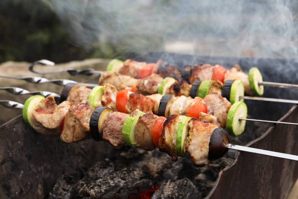 istock Cooking meat and vegetables on brazier outdoors 1408622847