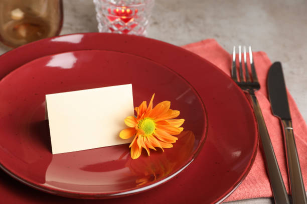 istock Beautiful autumn place setting with blank card and decor on grey table, closeup 1408622896