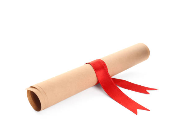 istock Rolled student's diploma with red ribbon isolated on white 1408623662