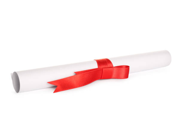 istock Rolled student's diploma with red ribbon isolated on white 1408623776