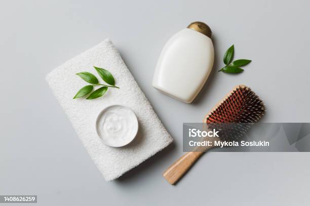 Cosmetic For Hair Care Cream And Towel On A Colored Background Top View Flat Lay Stock Photo - Download Image Now