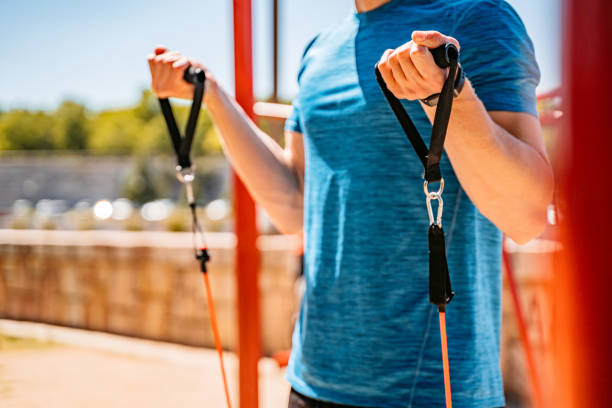 istock Young Man Training With Resistance Band 1408626490