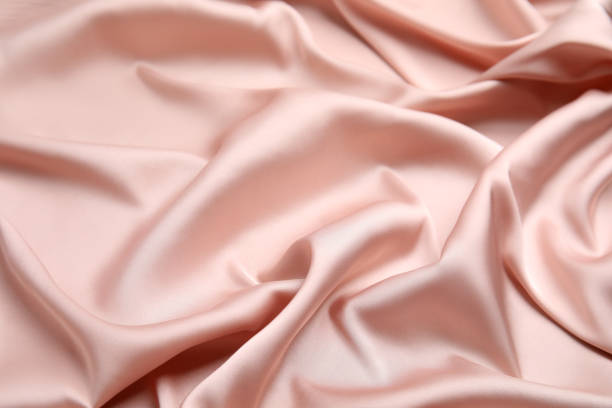 istock Texture of delicate pink silk as background, closeup 1408626631