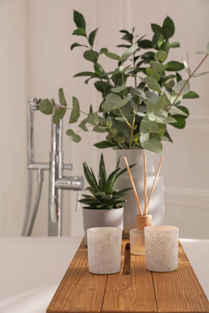 istock White bathtub with stylish decor and houseplants in bathroom. Interior design 1408626962