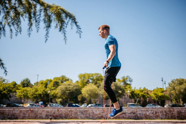 istock Young Man Jumping Rope On Quayside 1408627724