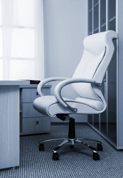 istock white leather armchair in modern office 1408628898