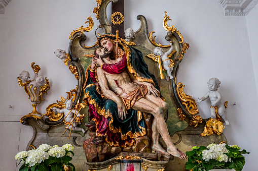 Andechs, bavaria, germany, june 03, 2022 : statue of madonna mary and jesus christ  Andechs abbey church, by scultptor Johann Baptist Straub, and painter Johann Baptist Zimmermann for frescoes and stuccoworks, 18th century
