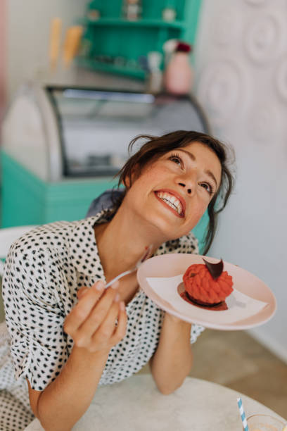 istock Trying the new cake in the menu 1408635635