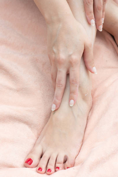 istock Young woman applying body moisturizer 1408637304