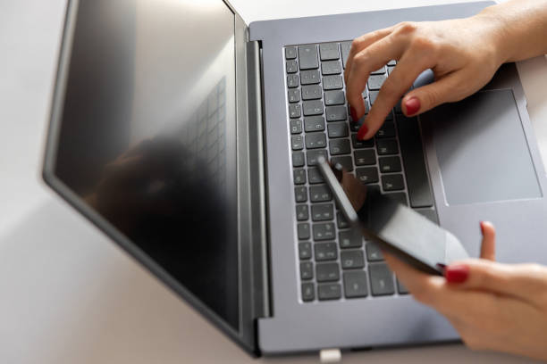 istock female hands on laptop keyboard 1408638884