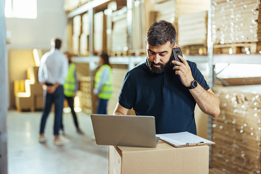 Working at the Warehouse with a laptop.